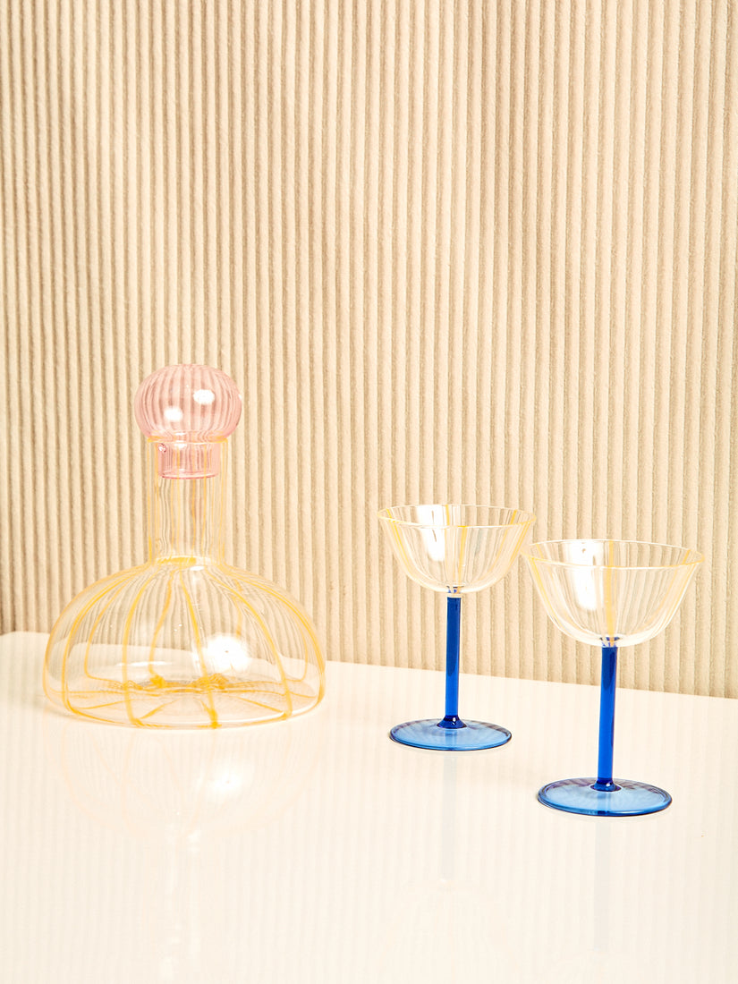 The Grand Soleil Decanter and a pair of yellow and blue Grand Soleil Coupes by Maison Balzac.