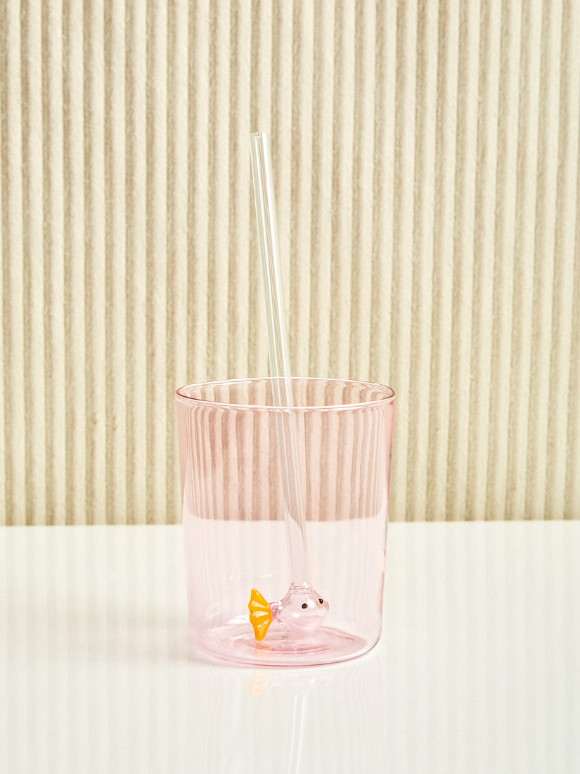 A pink and yellow fish straw sit inside of a pink cup.