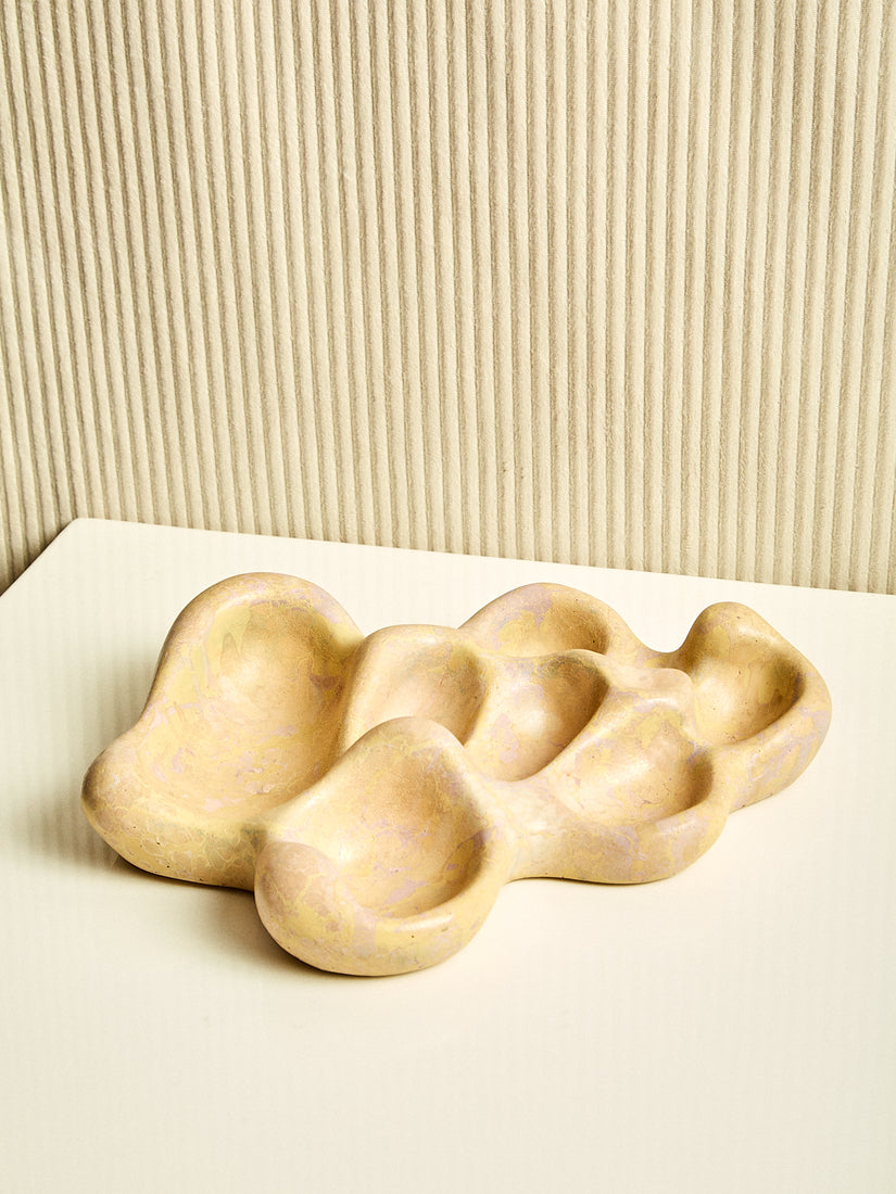 The Aphrodite Trinket Tray by Concrete Cat in the beige colorway.