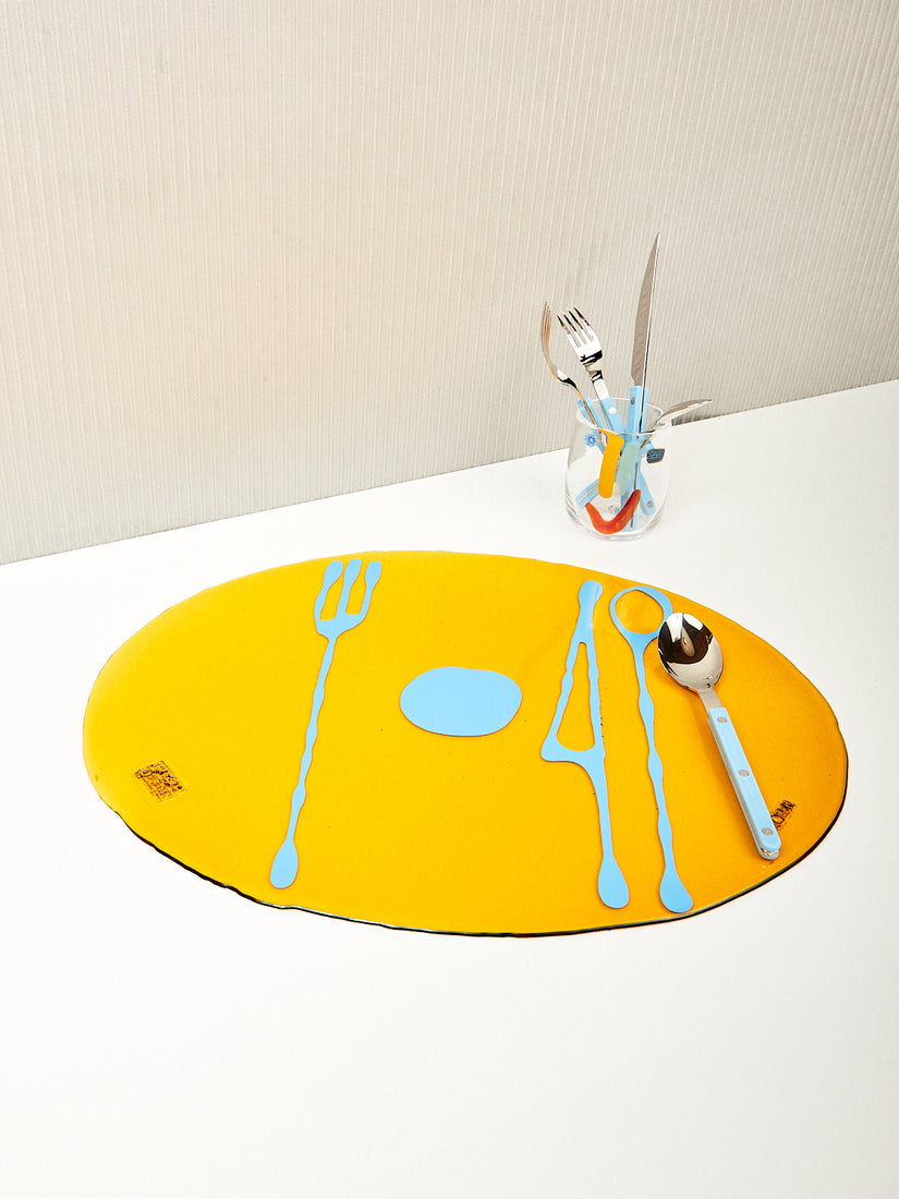 Amber and light blue Transparent Table-Mates Placemat by Gaetano Pesce for Fish Design. Styled with a Face Vessel and blue Sabre flatware.