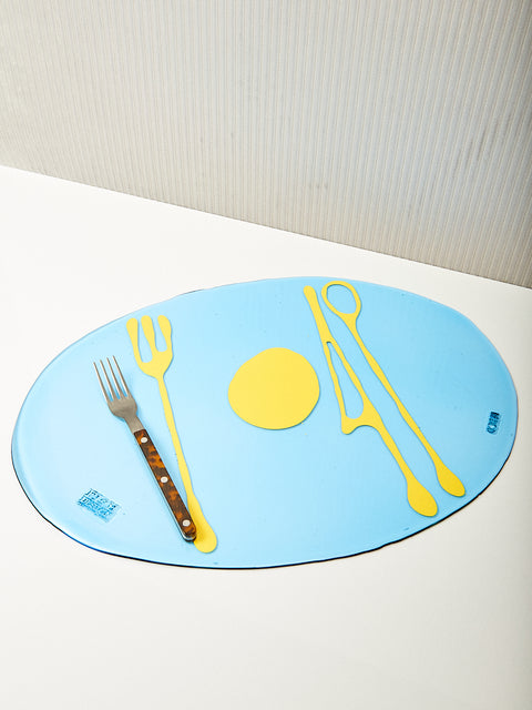 Blue and butter Transparent Table-Mates Placemat by Gaetano Pesce for Fish Design and a single tortoise Sabre fork.