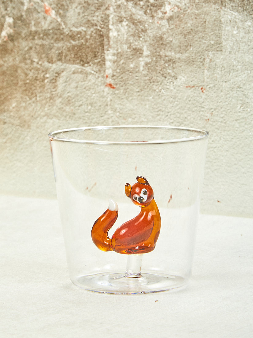 Animal Tumbler with a dark amber fox inside. The tail of the fox is white.