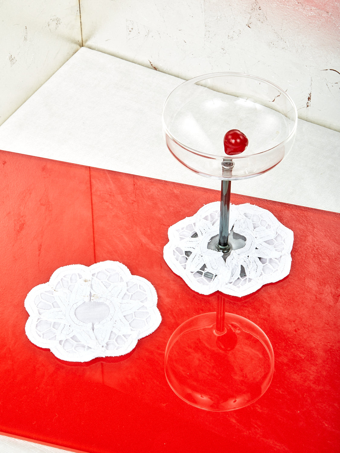 Lace Slippers for Stemware with one Manhattan Glass wearing one of the slippers.