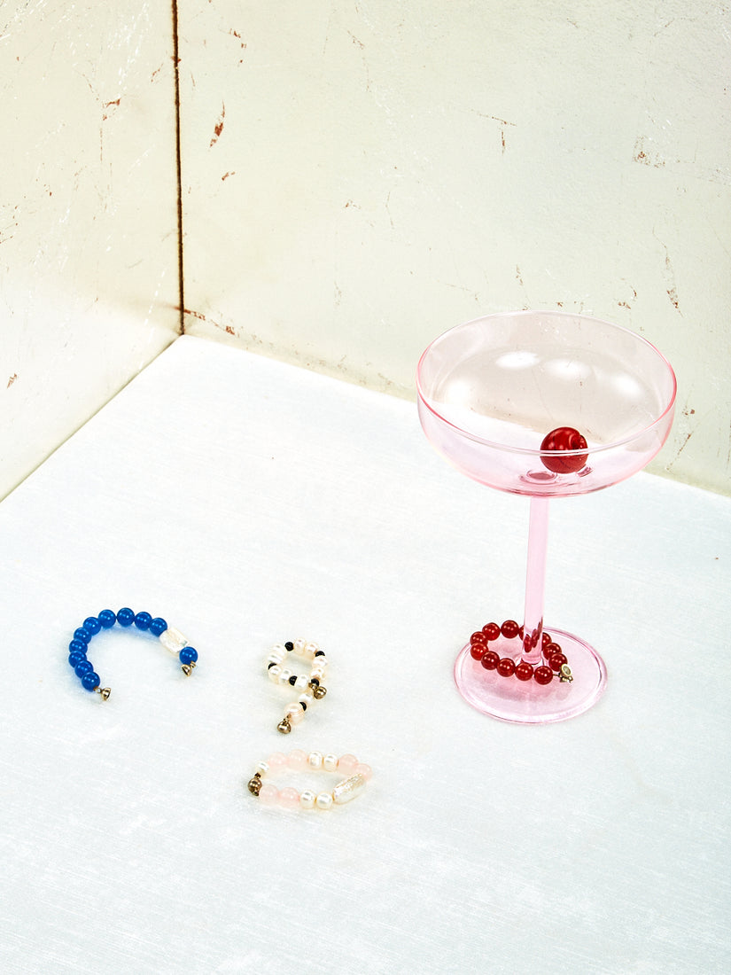 A Manhattan Glass wears the red bracelet form the set.