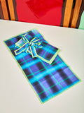 Single picture of Airbrush napkins showing dark blue and purple. They are airbrushed in a grid shape. 