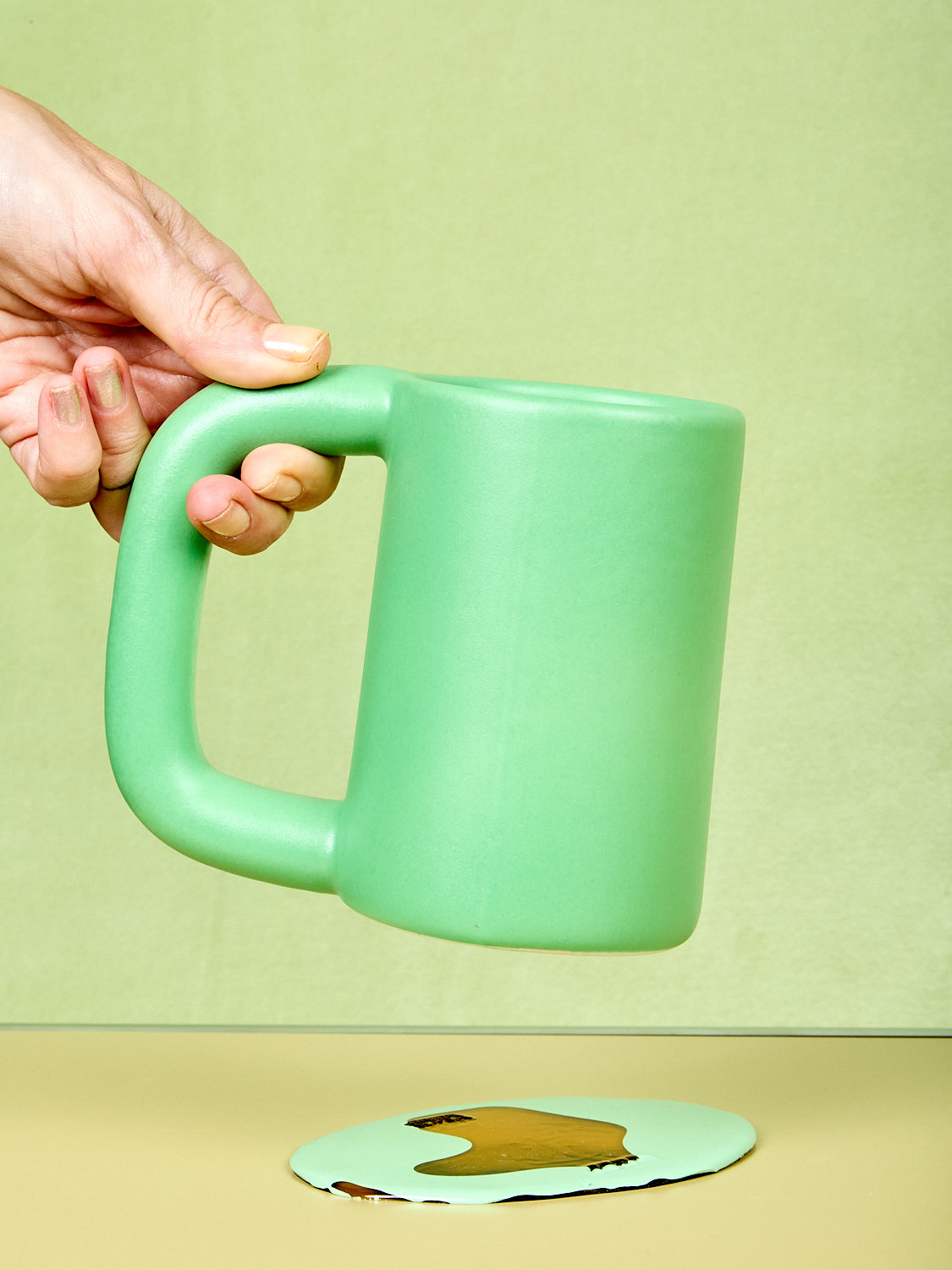 Green tall stoneware mug by Workaday Handmade