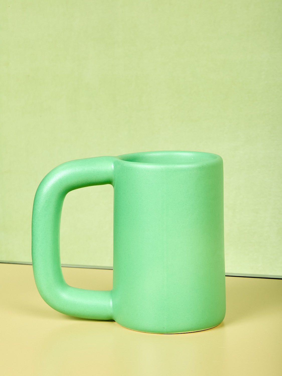 Green tall stoneware mug by Workaday Handmade