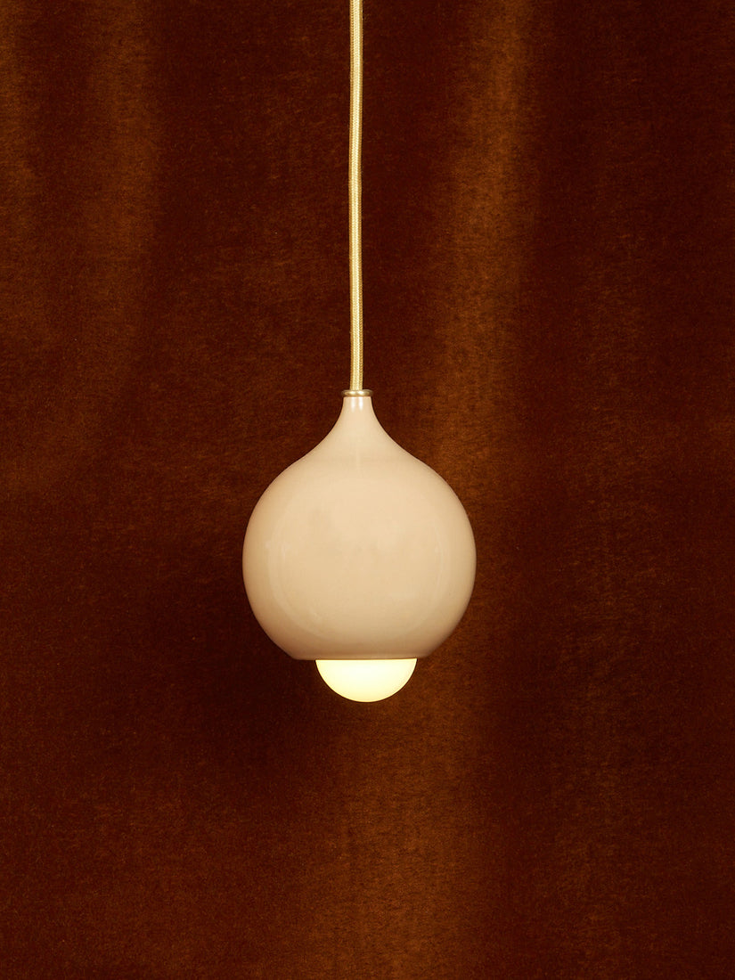 A gloss beige droplet pendant.