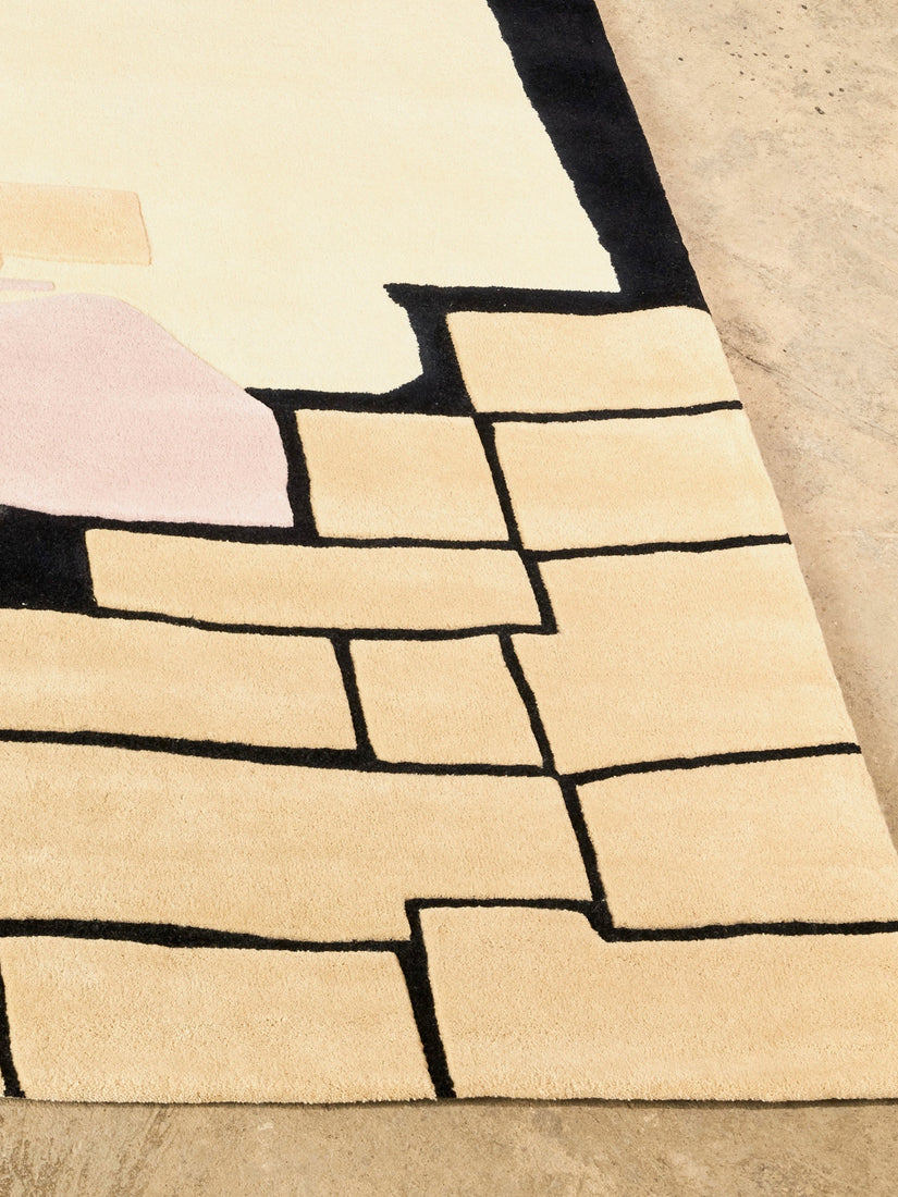 Close up of the peach, black, cream, and lilac abstract stacked design on The Guests rug.