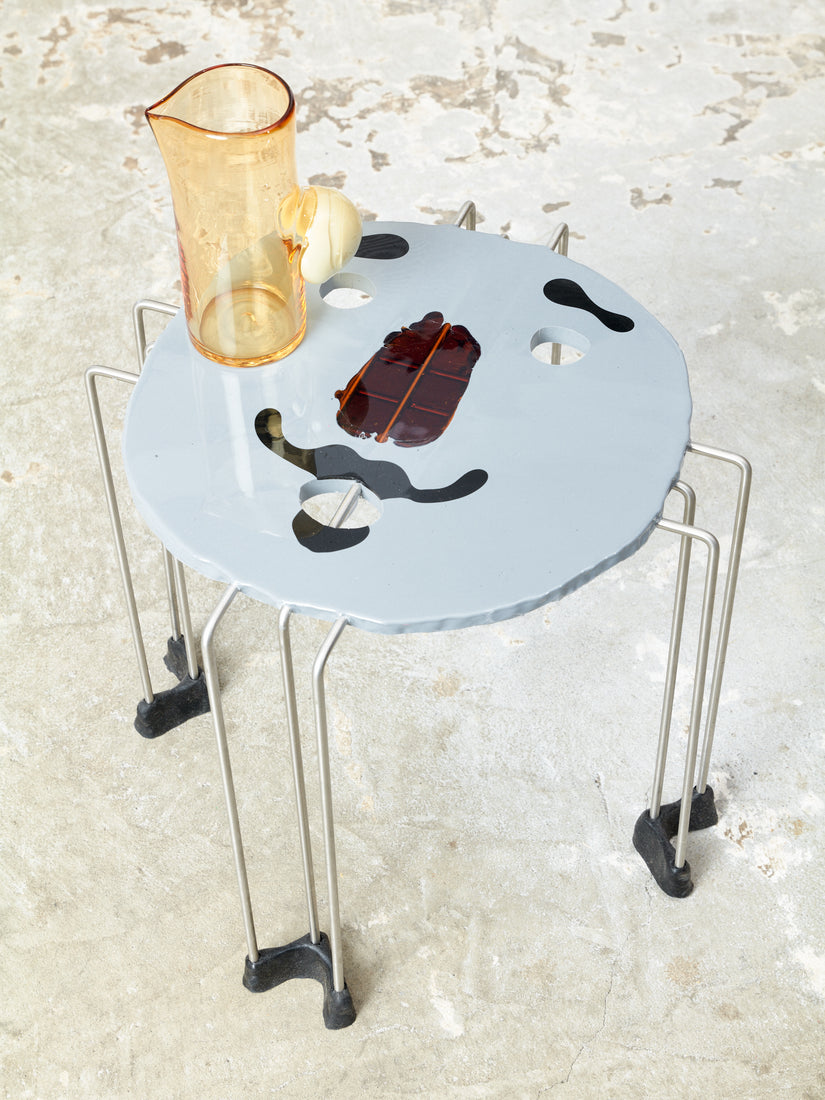 Grey Triple Play Face Table with a bubble pitcher on top.