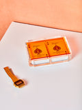 Orange Set of Luxe Playing Card by Luxe Dominoes. An acrylic case with a colored transparent acrylic lid and two decks of bicycle playing cards inside.