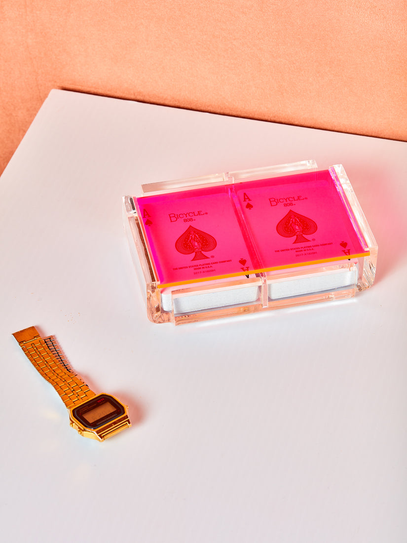 Pink Set of Luxe Playing Card by Luxe Dominoes. An acrylic case with a colored transparent acrylic lid and two decks of bicycle playing cards inside.
