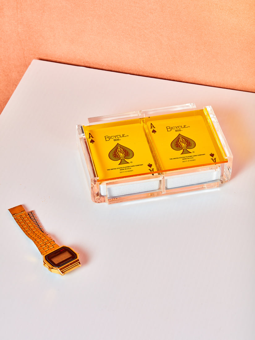 Yellow Set of Luxe Playing Card by Luxe Dominoes. An acrylic case with a colored transparent acrylic lid and two decks of bicycle playing cards inside.