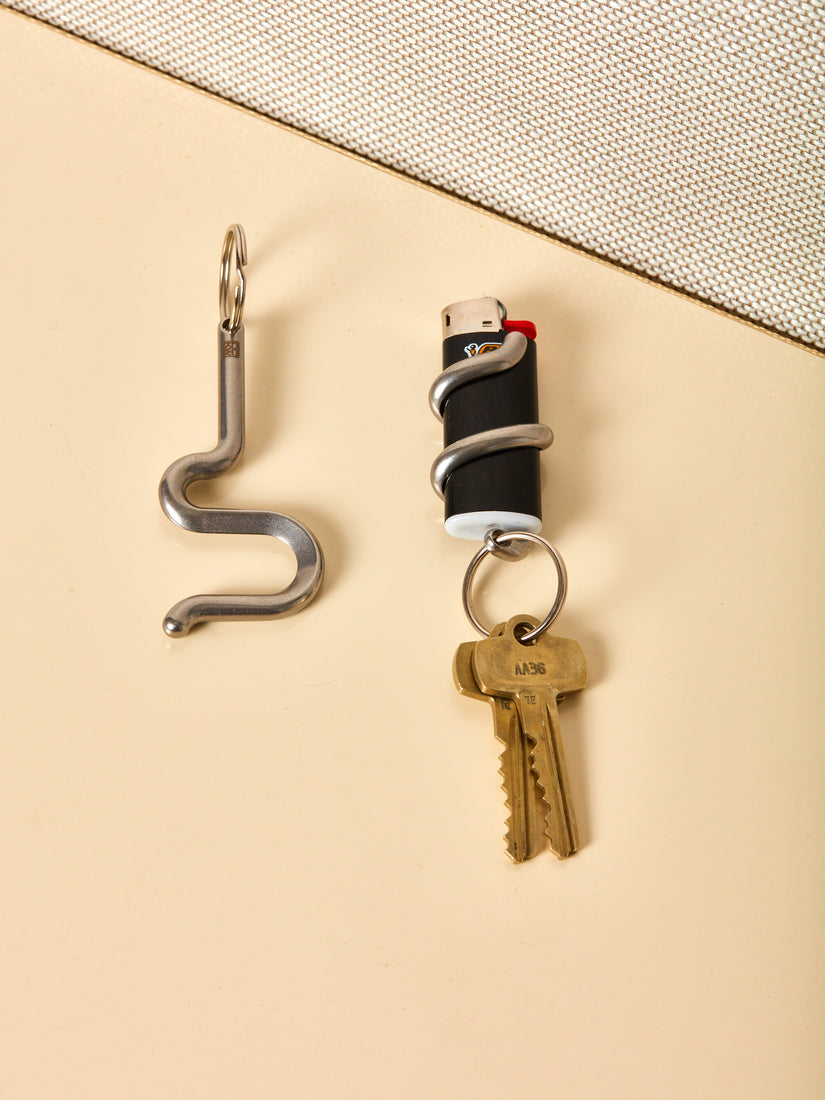 Serpent Bottle Opener and Lighter Holder Keychains by Chen and Kai.