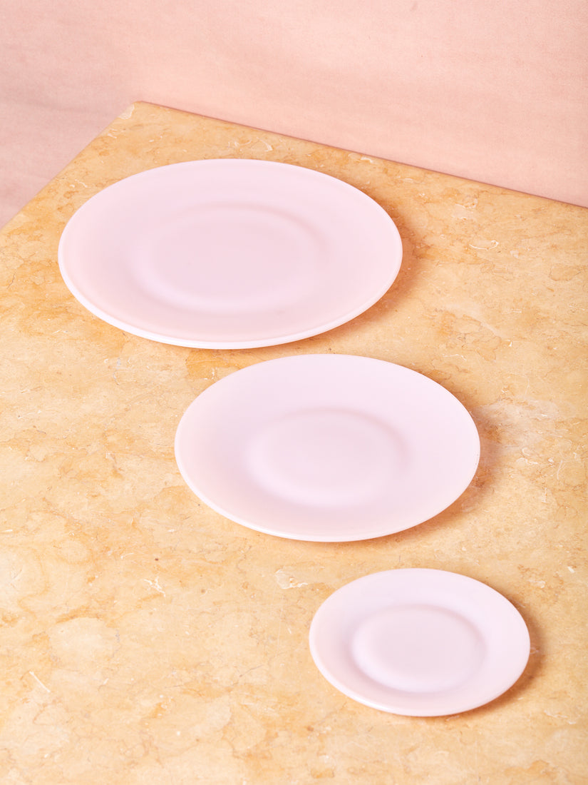 Large, medium, and small pink milk glass plates by Mosser.