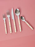 Ivory salad fork, dinner fork, dinner knife, dinner spoon, and teaspoon by Sabre.