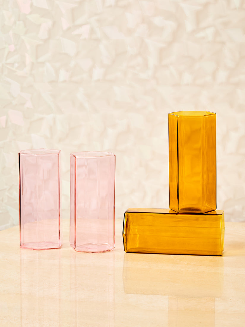 A pair of pink and pair of honey Coucou Glasses by Maison Balzac.