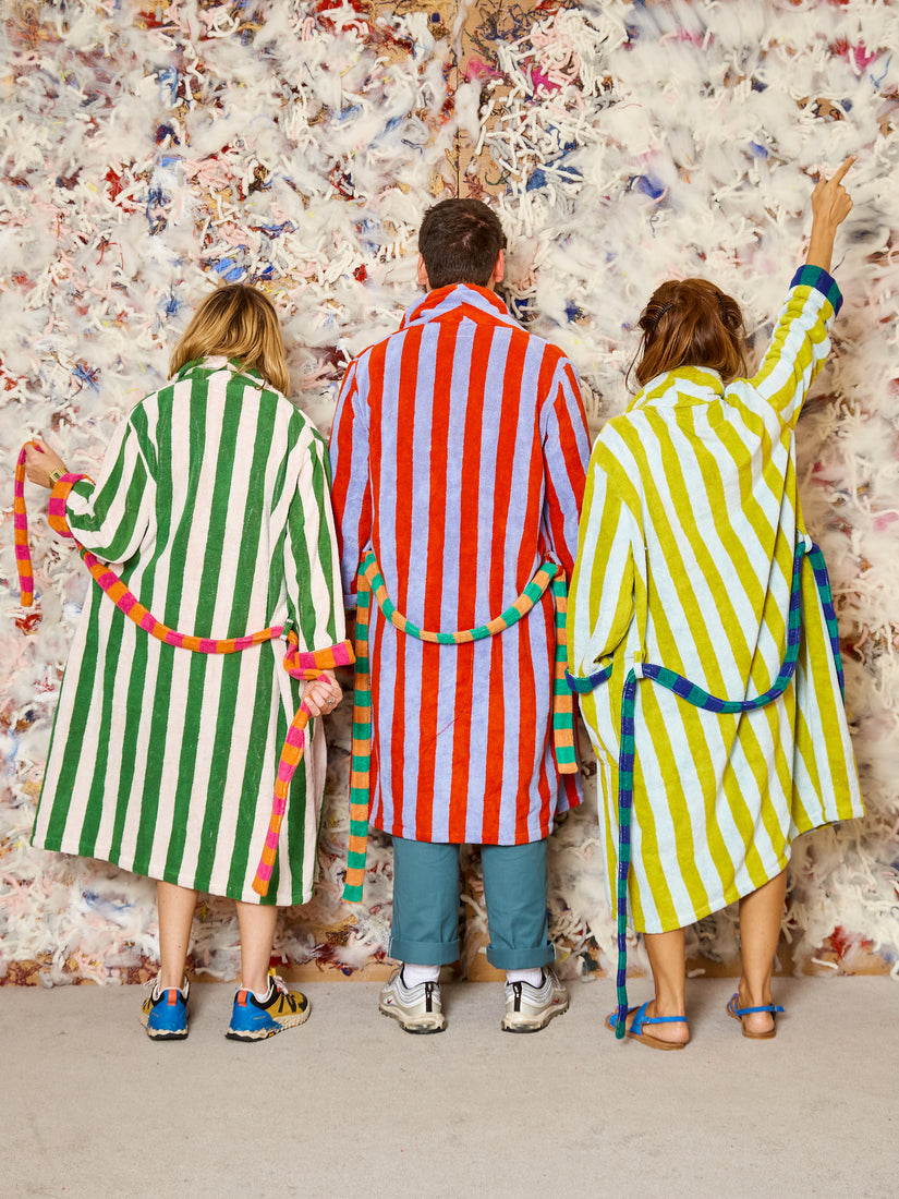 From left to right, Fabiana wear Green Stripe, Max wears Warm Stripe, and Helena wears Yellow Stripe Robes by Dusen Dusen.