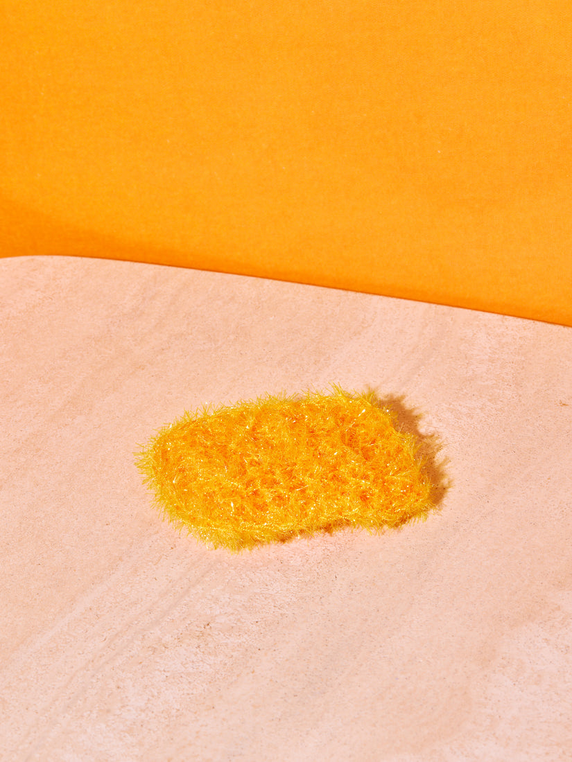 A single tangerine sponge.