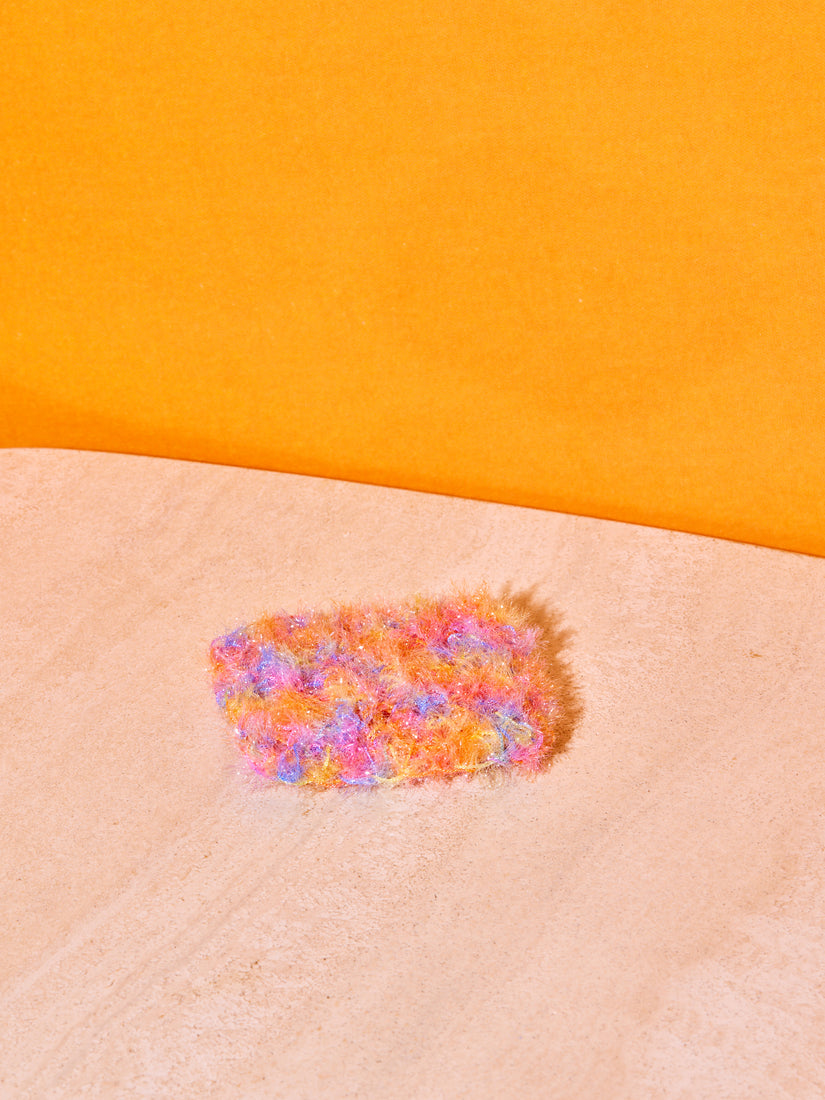 A single pastel rainbow sponge.