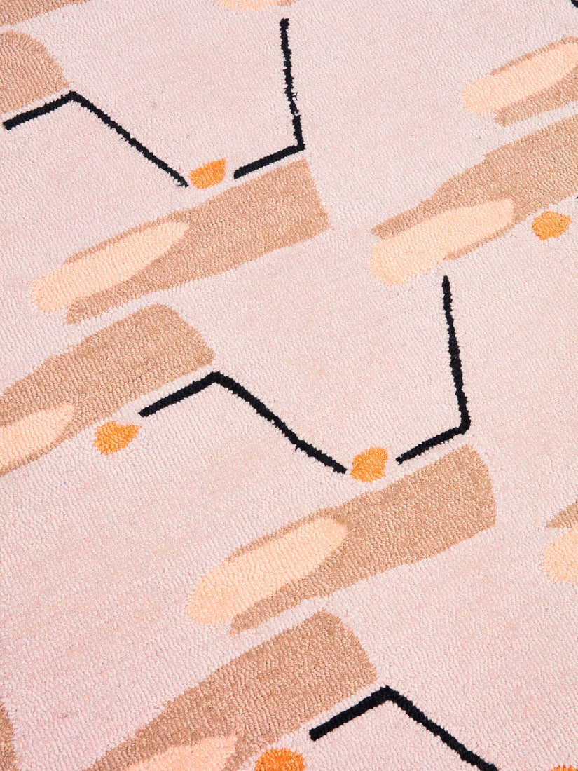 Close up of the beige, grey, black, cream, and orange toned abstract pattern.