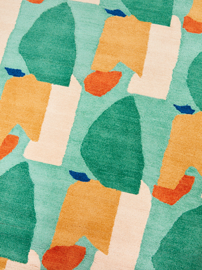 Close up of the teal, orange, and cream toned abstract pattern.