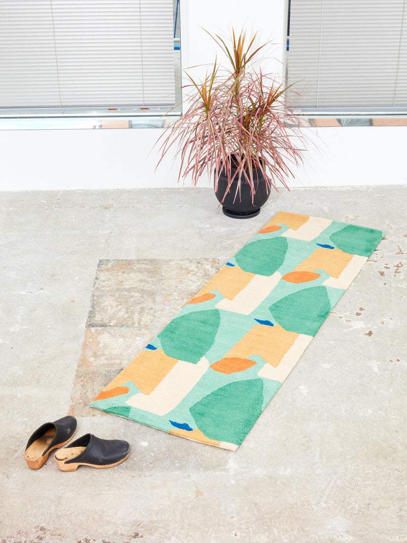 2x6 Summer Visitors Rug by Cold Picnic on a concrete floor.