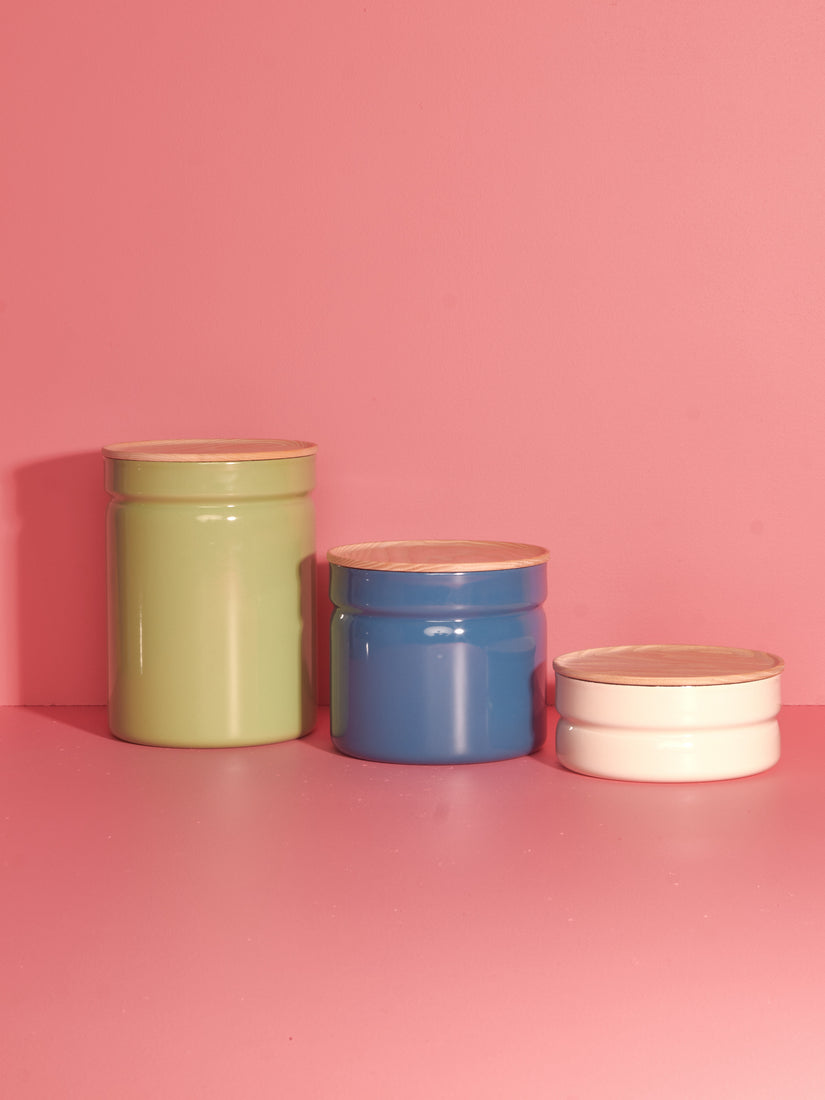 Storage Containers in Green, Blue, and White in 3 sizes from left to right.