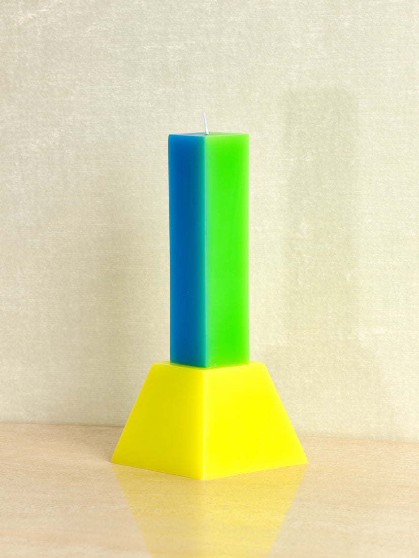 Happiness Candle by Yinka Ilori in Blue/Green with yellow base.