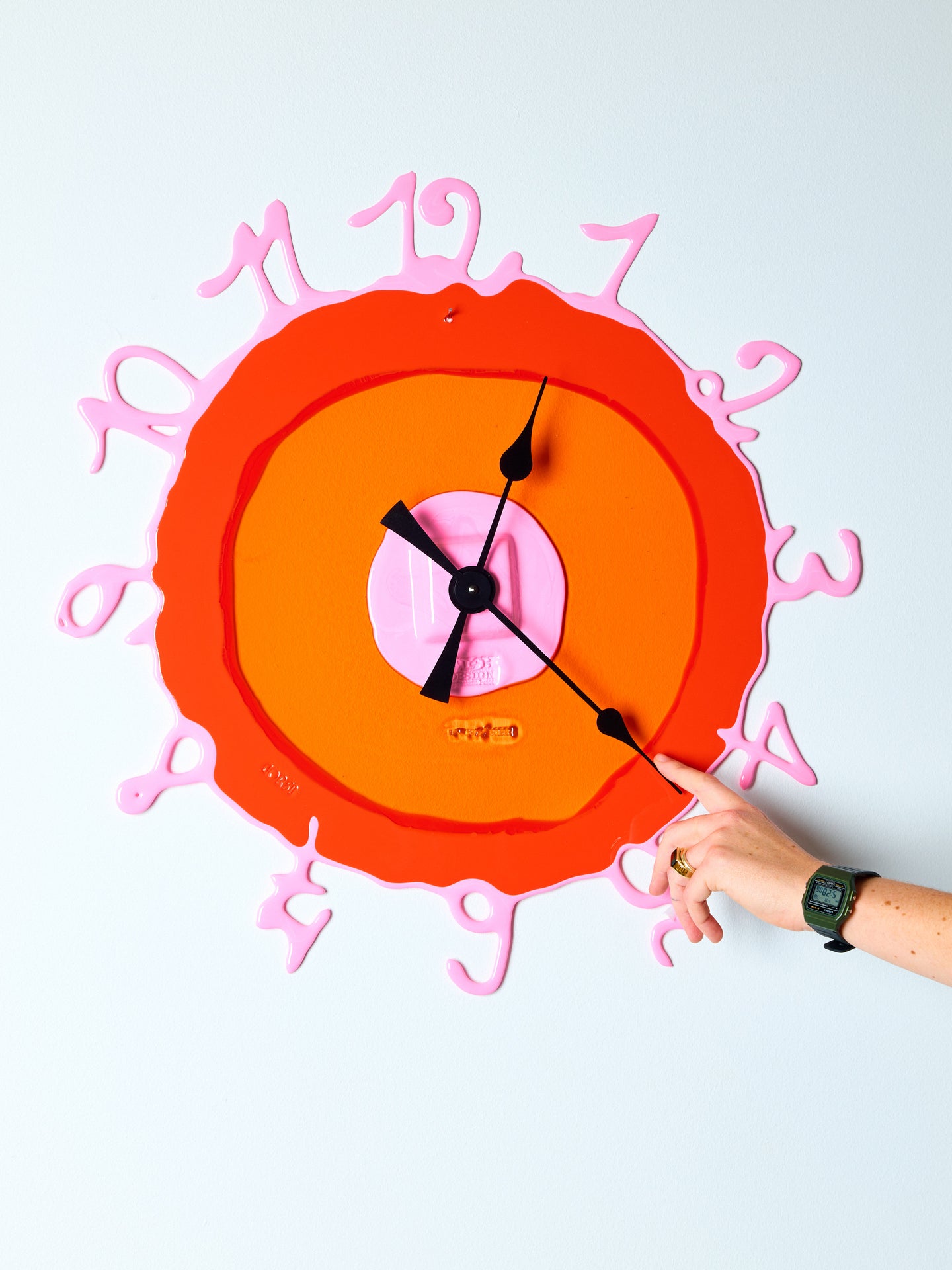 Handmade orange and pink resin mirror with resin-written numbers surrounding the border.