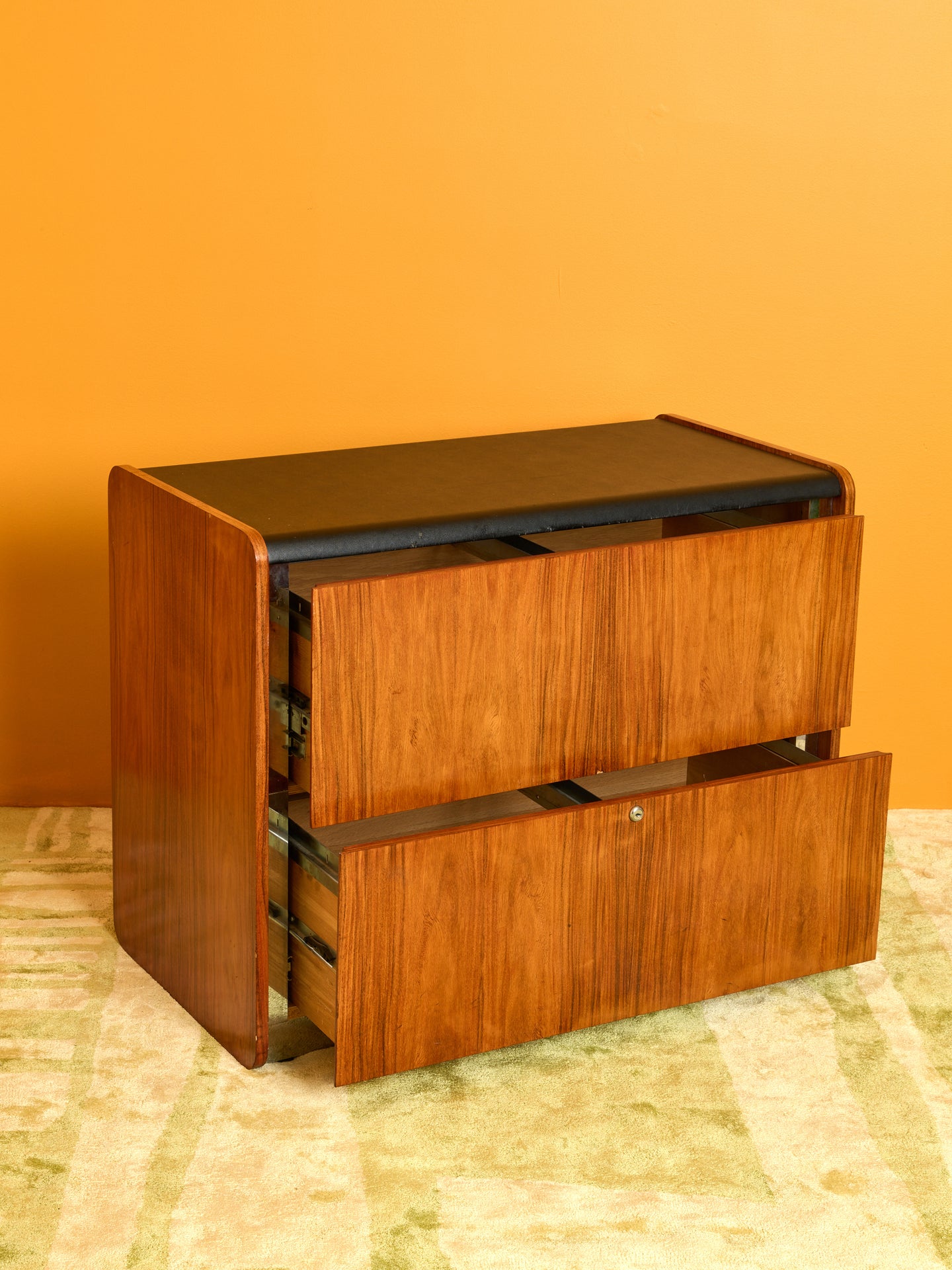 Vintage Storage Cabinet with its drawers pulled out slightly.