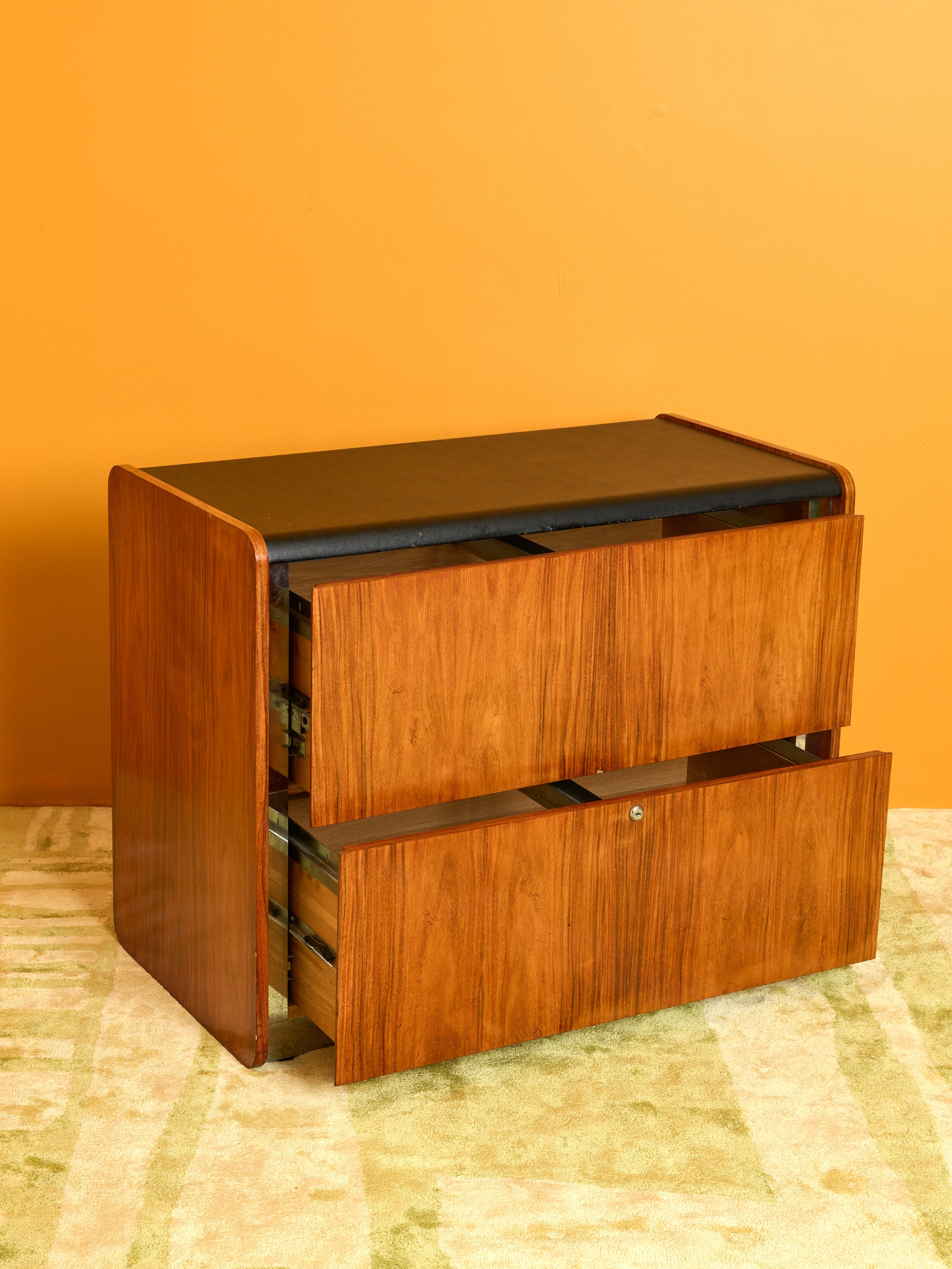Vintage Storage Cabinet with its drawers pulled out slightly.