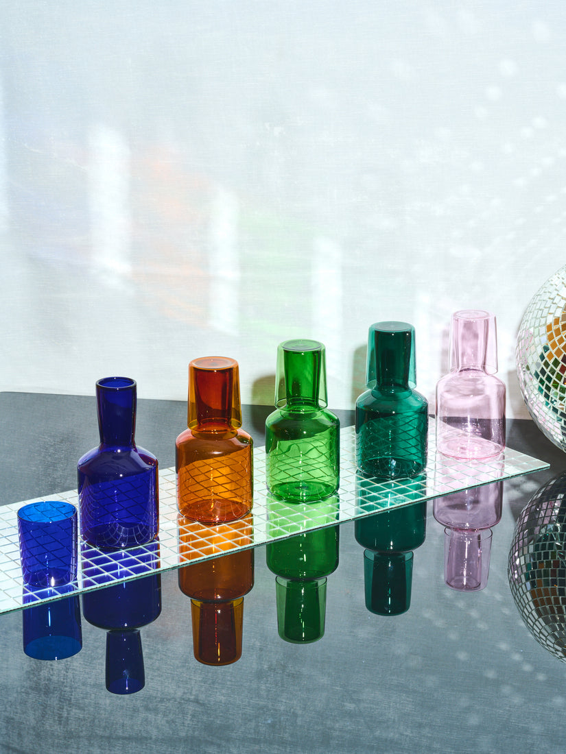 Bedside Carafes by Maison Balzac in 5 different colors in a line.