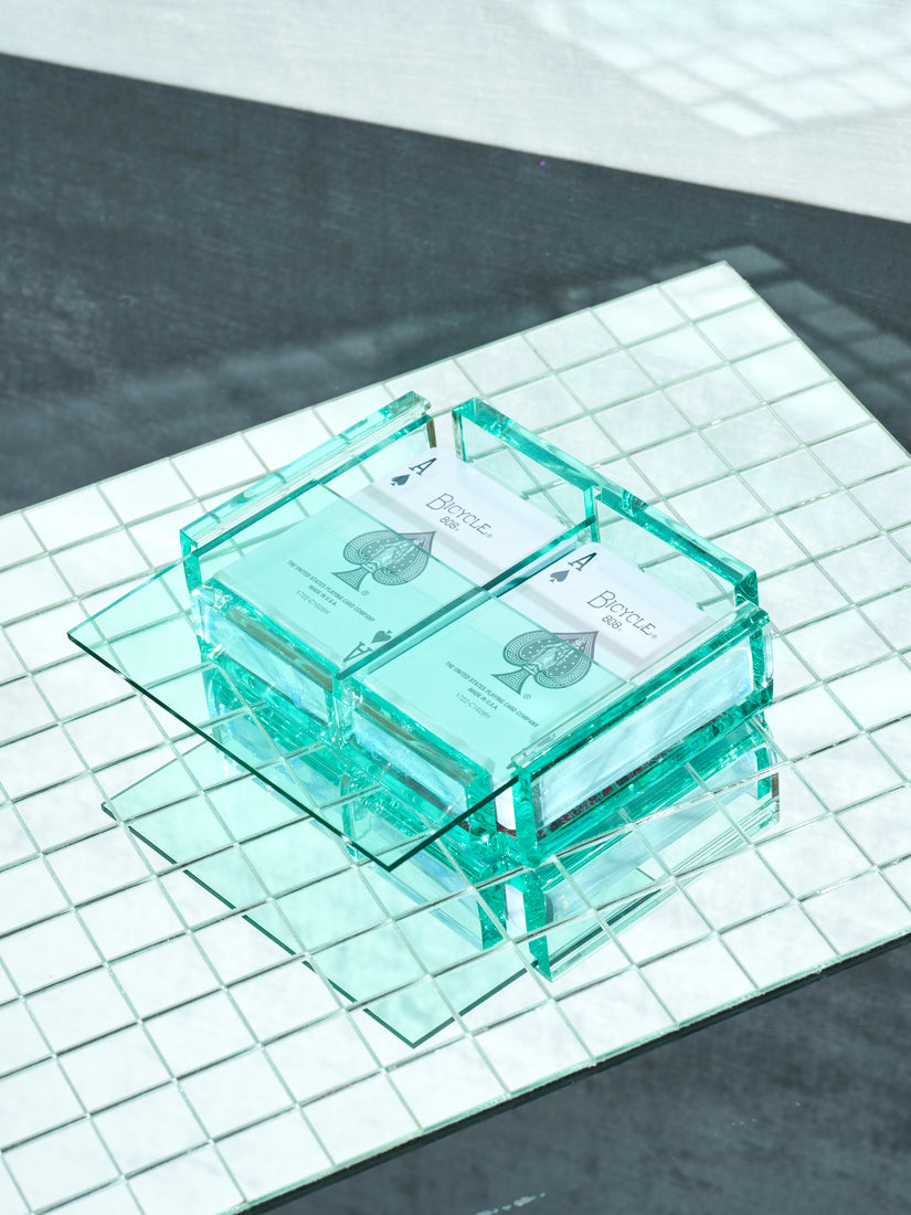 Crystal Set of Luxe Playing Card by Luxe Dominoes. A glass colored acrylic box and lid and two decks of bicycle playing cards inside.