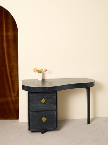 Vintage wooden desk with a curved top and two drawers.