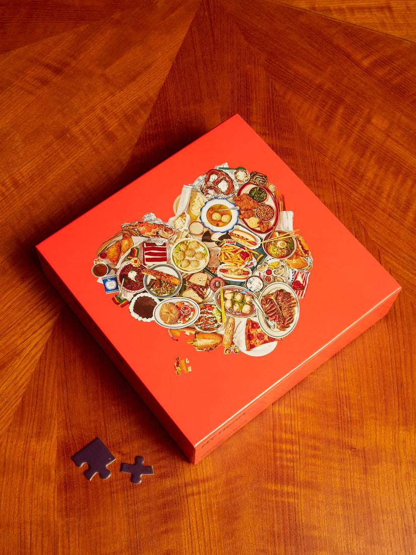 The NY Heart Puzzle by Areaware, a heart shaped image of different foods from NY!