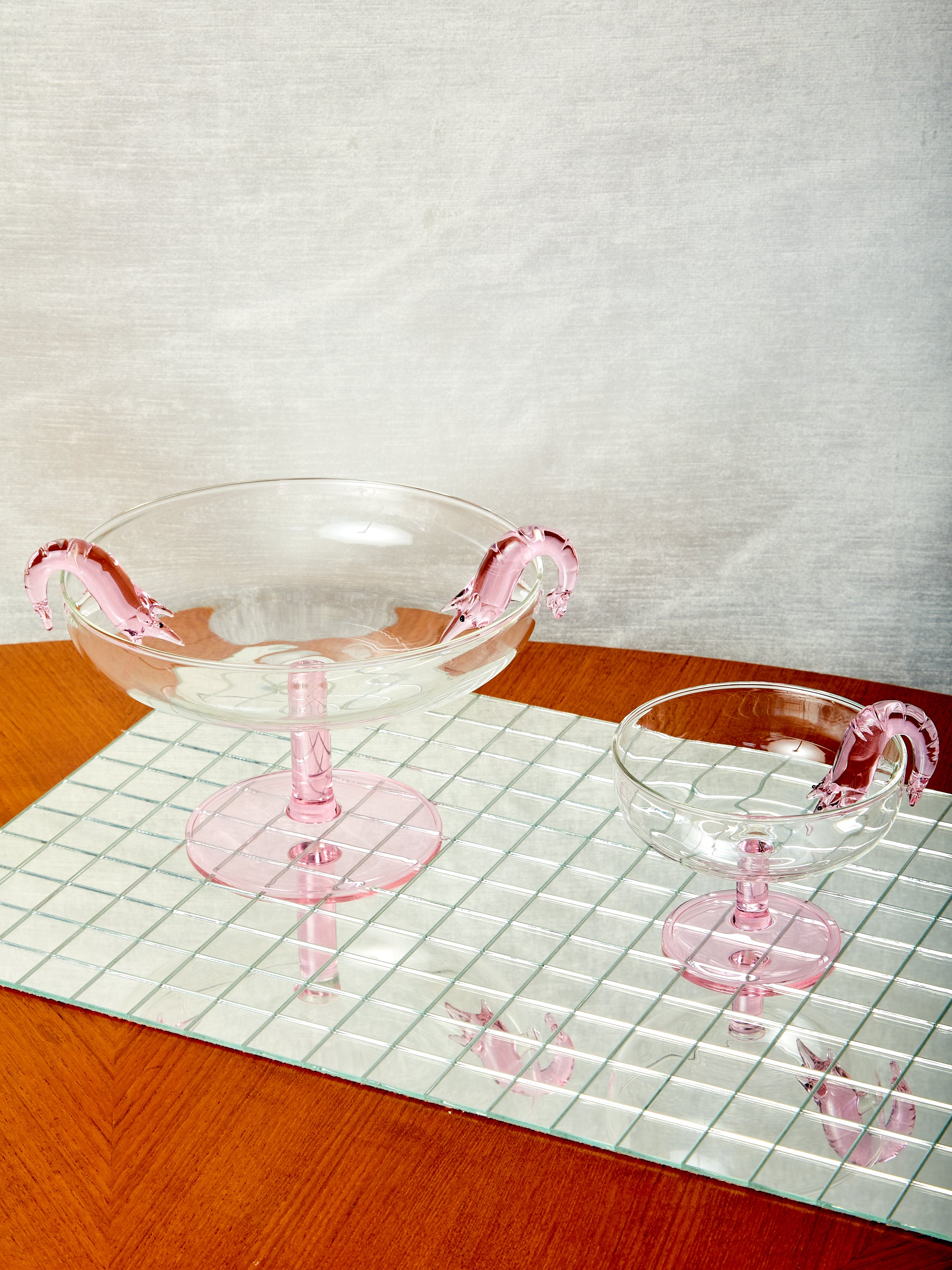 A Shrimp Cocktail Platter sits left of a Shrimp Cocktail Coupe by Maison Balzac.