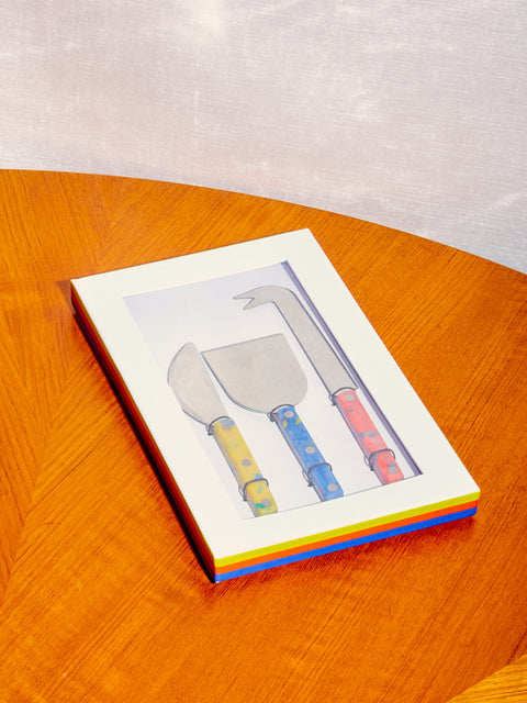 Cheese Knives by Fredericks and Mae inside thier box with transparent window.