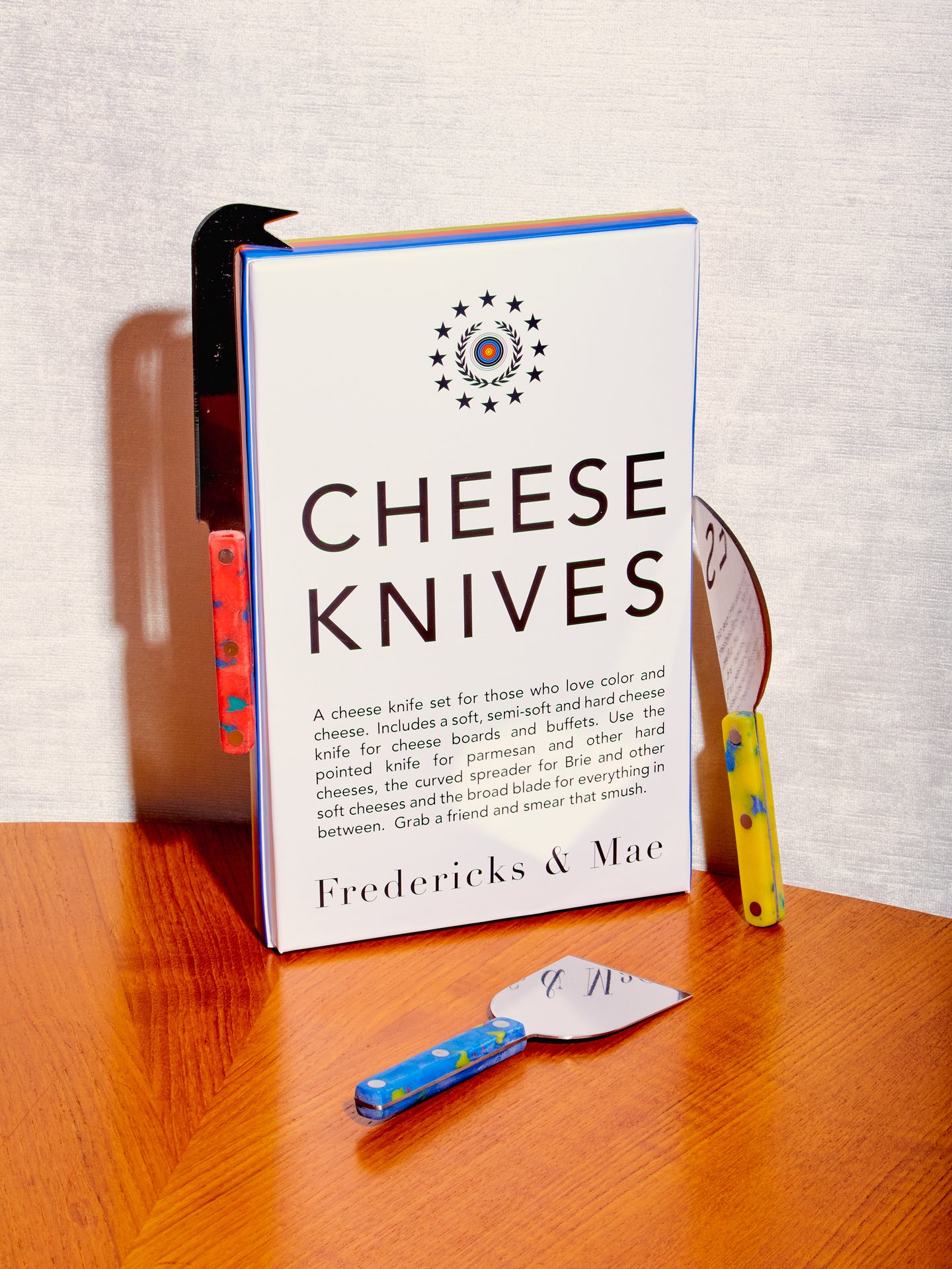 Cheese Knives by Fredericks and Mae surround their branded box.