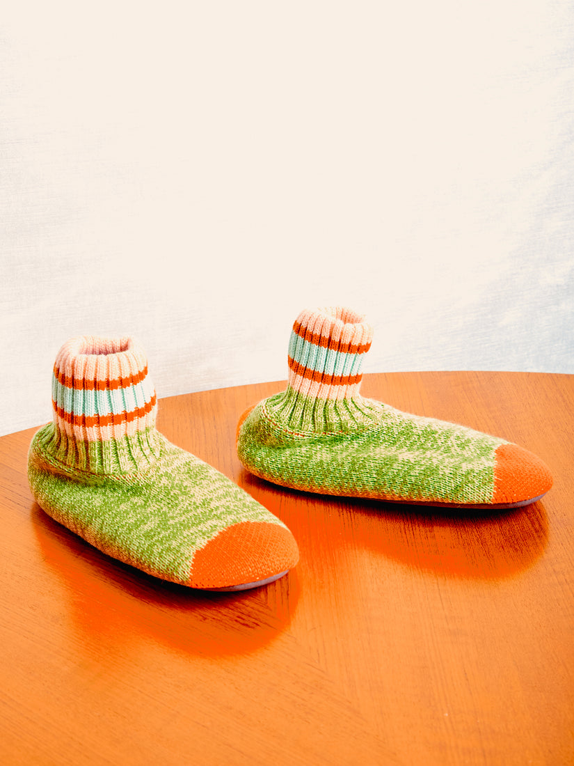 A pair of green sock slippers by Verloop.