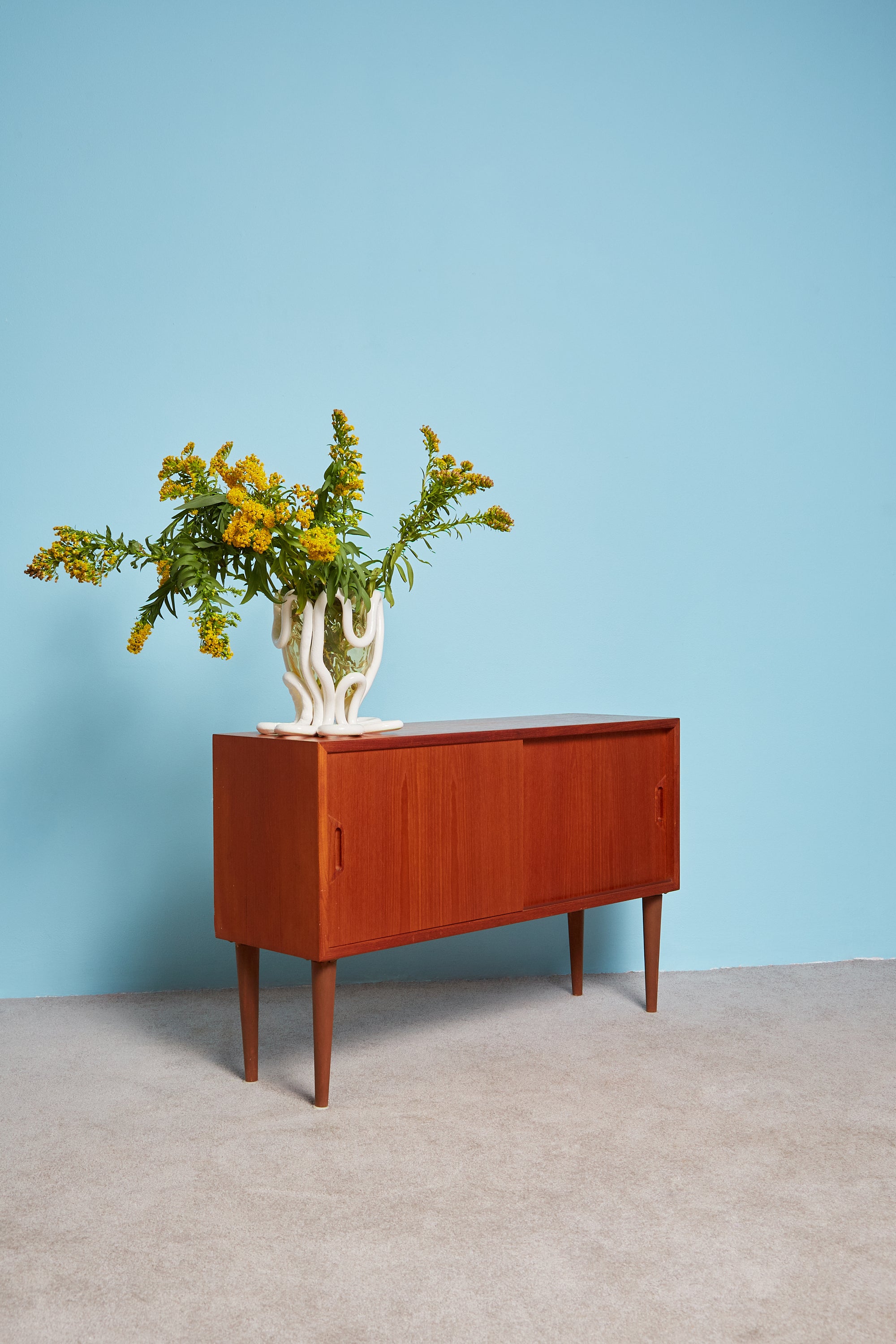 Vintage Sideboard with a white Indian Summer on top.