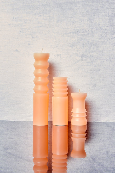 Peach Totem Candles in small, medium, and large.