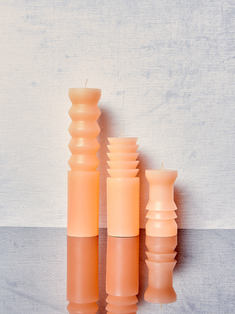 Peach Totem Candles in small, medium, and large.