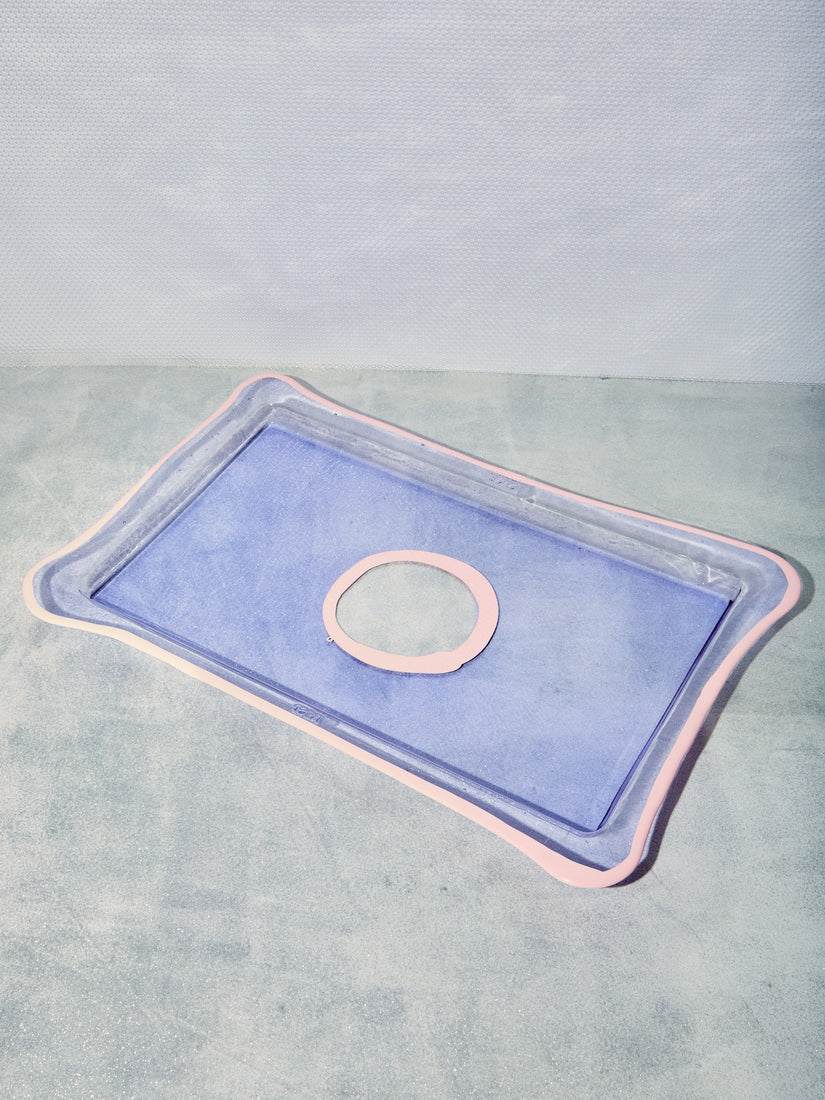 A Large Rectangular Tray in Lavender with light pink trim and circle in the center.