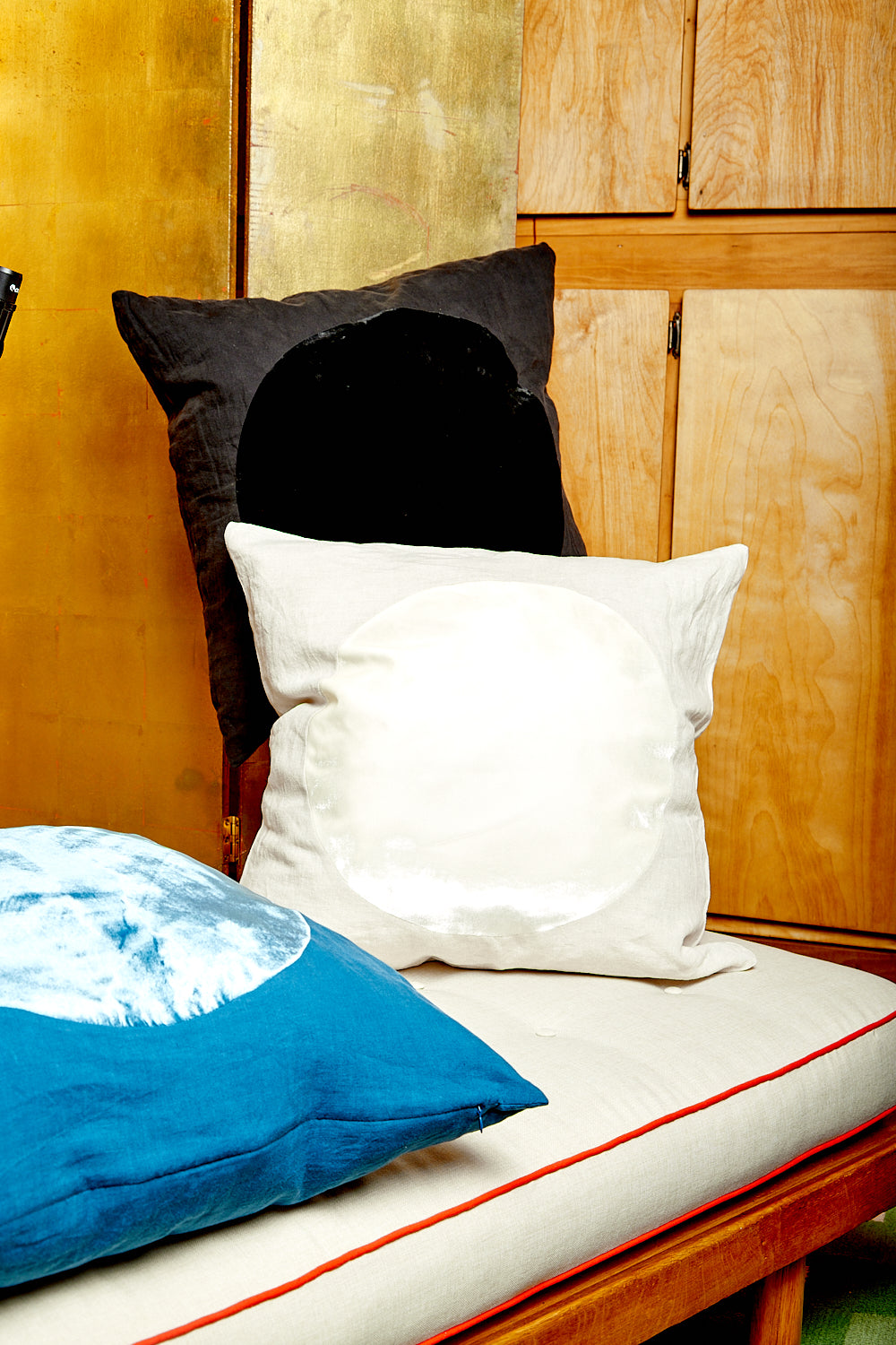 A white, black, and blue Velvet Circle Pillow.