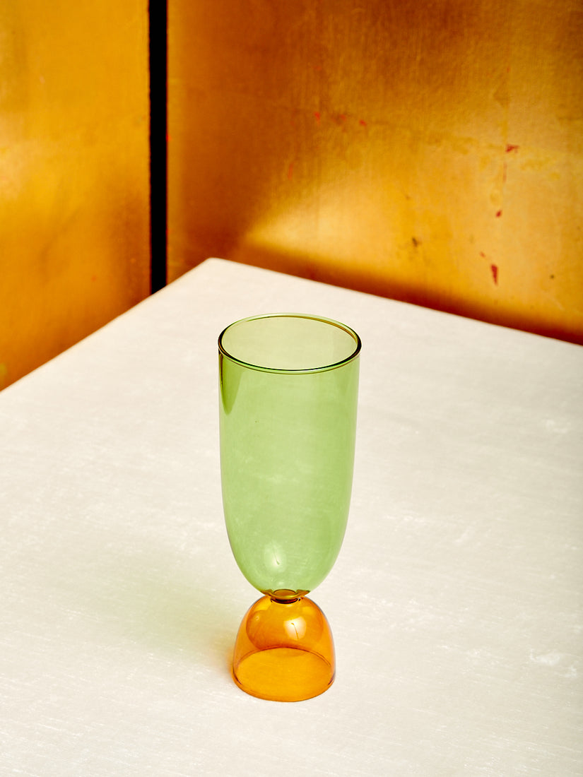 A green top amber bottom Harry Highball Glass.
