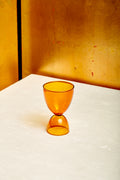 An amber cocktail glass.