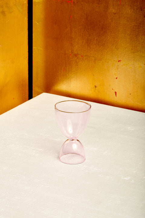 A pink cocktail glass.