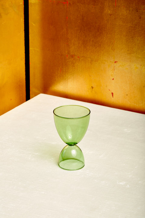 A green cocktail glass.