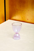 A lavender cocktail glass.